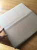 A square cardboard package on a table